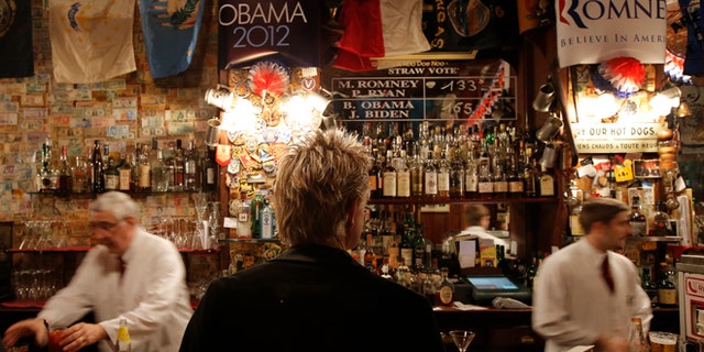 Oct. 31, 2012: The temporary results of a U.S. presidential election straw vote is displayed on a board at Harry's Bar in Paris.