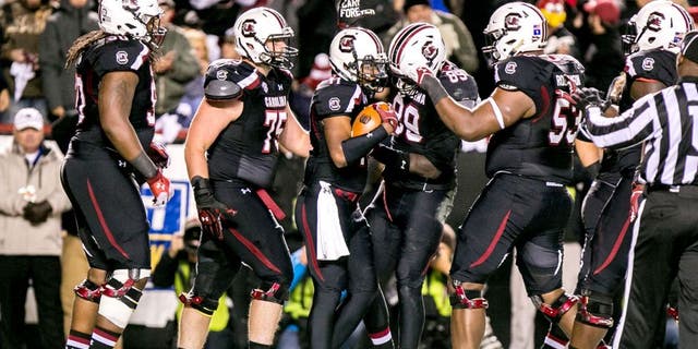 Nov 1, 2014; Columbia, SC, USA; South Carolina Gamecocks wide receiver Pharoh Cooper (11) is congratulated for a touchdown against the Tennessee Volunteers in the first quarter at Williams-Brice Stadium. Mandatory Credit: Jeff Blake-USA TODAY Sports