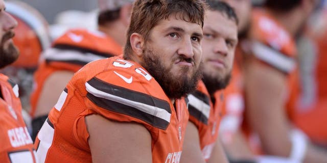 Nov 1, 2015; Cleveland, OH, USA; Cleveland Browns center Alex Mack (55) and guard Joel Bitonio (75) sit on the bench during the fourth quarter against the Arizona Cardinals at FirstEnergy Stadium. The Cardinals won 34-20. Mandatory Credit: Ken Blaze-USA TODAY Sports