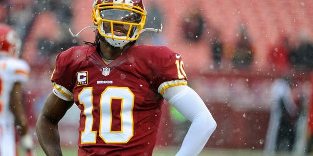 Dec 8, 2013; Landover, MD, USA; Washington Redskins quarterback Robert Griffin III (10) warms up before the game against the Kansas City Chiefs at FedEx Field. Mandatory Credit: Brad Mills-USA TODAY Sports