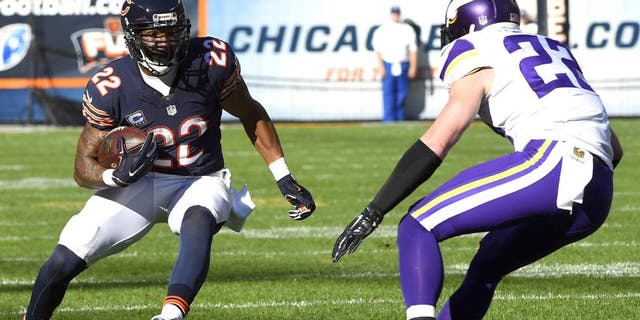 Nov 1, 2015; Chicago, IL, USA; Chicago Bears running back Matt Forte (22) carries the ball as Minnesota Vikings free safety Harrison Smith (22) defends during the second half at Soldier Field. Mandatory Credit: Mike DiNovo-USA TODAY Sports
