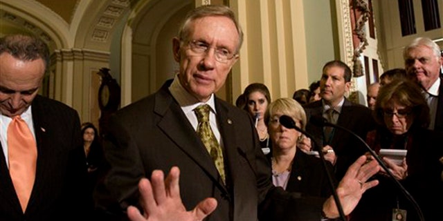Senate Majority Leader Harry Reid of Nev. gestures on Capitol Hill, Tuesday, Nov. 3, 2009, following the weekly caucus luncheons. Sen. Charles Schumer, D-N.Y. is at left. (AP Photo)