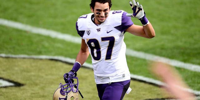 Nov 1, 2014; Boulder, CO, USA; Washington Huskies wide receiver Dante Pettis (87) reacts following the win over the Colorado Buffaloes at Folsom Field. The Huskies defeated the Buffaloes 38-23. Mandatory Credit: Ron Chenoy-USA TODAY Sports