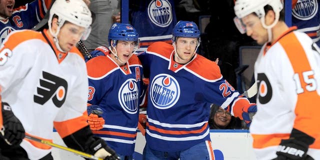 EDMONTON, AB - NOVEMBER 3: Ryan Nugent-Hopkins #93 and Leon Draisaitl #29 of the Edmonton Oilers celebrate after a goal during a game against the Philadelphia Flyers on November 3, 2015 at Rexall Place in Edmonton, Alberta, Canada. (Photo by Andy Devlin/NHLI via Getty Images)