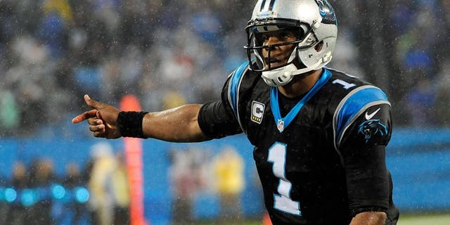 Nov 2, 2015; Charlotte, NC, USA; Carolina Panthers quarterback Cam Newton (1) prepares to take the snap during the second half of the game against the Indianapolis Colts at Bank of America Stadium. Mandatory Credit: Sam Sharpe-USA TODAY Sports