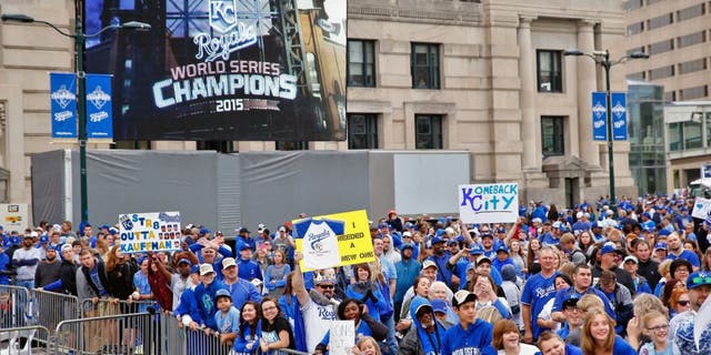 KANSAS CITY, MO - NOVEMBER 03: Fans cheer during a parade and celebration in honor of the Kansas City Royals' World Series win on November 3, 2015 in Kansas City, Missouri. (Photo by Jamie Squire/Getty Images)