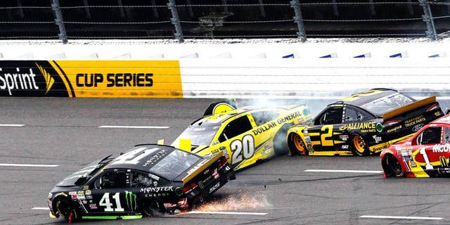 MARTINSVILLE, VA - NOVEMBER 01: Kurt Busch, driver of the #41 Monster Energy Chevrolet, Matt Kenseth, driver of the #20 Dollar General Toyota, Brad Keselowski, driver of the #2 Alliance Truck Parts Ford, and Jamie McMurray, driver of the #1 McDonald's Chevrolet, are involved in an on-track incident during the NASCAR Sprint Cup Series Goody's Headache Relief Shot 500 at Martinsville Speedway on November 1, 2015 in Martinsville, Virginia. (Photo by Brian Lawdermilk/NASCAR via Getty Images)