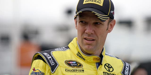 MARTINSVILLE, VA - OCTOBER 31: Matt Kenseth, driver of the #20 Dollar General Toyota, walks through the garage area during practice for the NASCAR Sprint Cup Series Goody's Headache Relief Shot 500 at Martinsville Speedway on October 31, 2015 in Martinsville, Virginia. (Photo by Jonathan Moore/Getty Images)