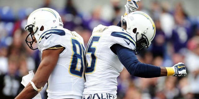 Nov 1, 2015; Baltimore, MD, USA; San Diego Chargers wide receiver Malcolm Floyd (80) is congratulated by wide receiver Dontrelle Inman (15) after scoring a touchdown in the third quarter against the Baltimore Ravens at M&T Bank Stadium. Mandatory Credit: Evan Habeeb-USA TODAY Sports