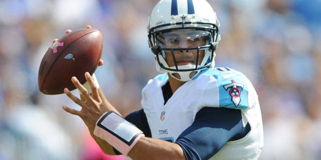 Oct 11, 2015; Nashville, TN, USA; Tennessee Titans quarterback Marcus Mariota (8) drops back to pass during the first half against the Buffalo Bills at Nissan Stadium. Mandatory Credit: Christopher Hanewinckel-USA TODAY Sports