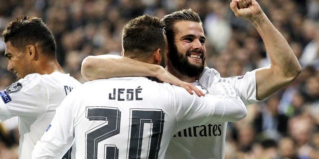 MADRID, SPAIN - NOVEMBER 03: Nacho Fernandez (R) of Real Madrid celebrates with Jese Rodriguez after scoring the opening goal during the UEFA Champions League Group A match between Real Madrid and Paris Saint-Germain at Estadio Santiago Bernabeu on November 3, 2015 in Madrid, Spain. (Photo by Angel Martinez/Real Madrid via Getty Images)