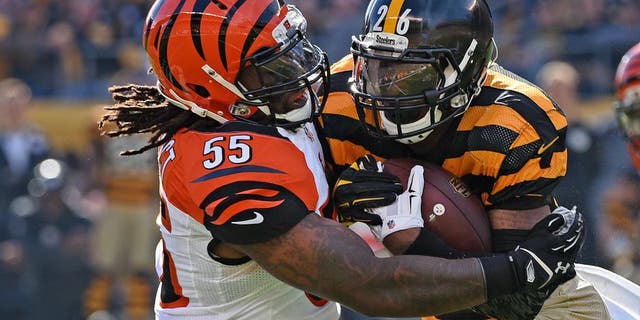 PITTSBURGH, PA - NOVEMBER 1: Linebacker Vontaze Burfict #55 of the Cincinnati Bengals tackles running back Le'Veon Bell #26 of the Pittsburgh Steelers during a game at Heinz Field on November 1, 2015 in Pittsburgh, Pennsylvania. The Bengals defeated the Steelers 16-10. (Photo by George Gojkovich/Getty Images)