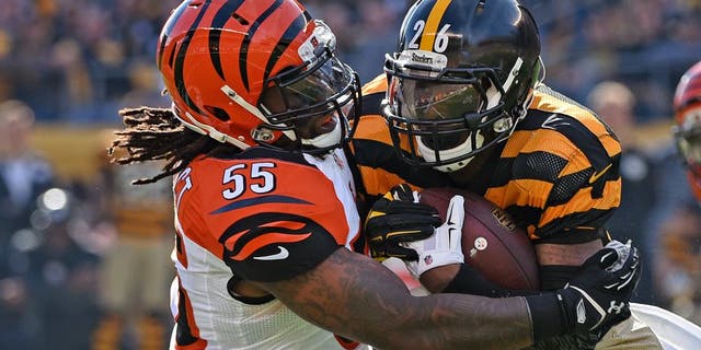 PITTSBURGH, PA - NOVEMBER 1: Linebacker Vontaze Burfict #55 of the Cincinnati Bengals tackles running back Le'Veon Bell #26 of the Pittsburgh Steelers during a game at Heinz Field on November 1, 2015 in Pittsburgh, Pennsylvania. The Bengals defeated the Steelers 16-10. (Photo by George Gojkovich/Getty Images)