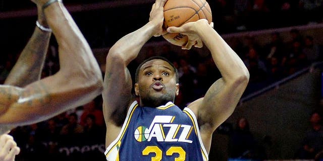 Nov 3, 2014; Los Angeles, CA, USA; Utah Jazz forward Trevor Booker (33) shoots the ball during the first half of a game against the Los Angeles Clippers at Staples Center. Mandatory Credit: Richard Mackson-USA TODAY Sports