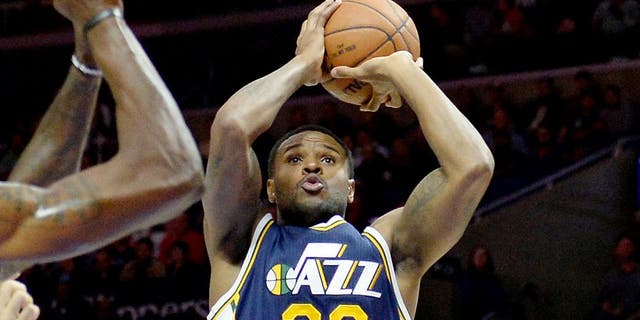 Nov 3, 2014; Los Angeles, CA, USA; Utah Jazz forward Trevor Booker (33) shoots the ball during the first half of a game against the Los Angeles Clippers at Staples Center. Mandatory Credit: Richard Mackson-USA TODAY Sports