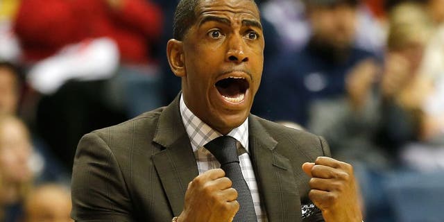 STORRS, CT- NOVEMBER 30: Head coach Kevin Ollie of the Connecticut Huskies reacts during a game with Texas Longhorns at Harry A. Gampel Pavilion on November 30, 2014 in Storrs, Connecticut. (Photo by Jim Rogash/Getty Images)
