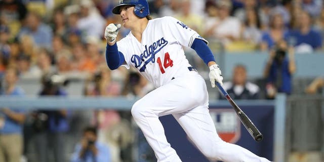 LOS ANGELES, CA - OCTOBER 10: Enrique Hernandez #14 of the Los Angeles Dodgers hits a single in the third inning against the New York Mets in game two of the National League Division Series at Dodger Stadium on October 10, 2015 in Los Angeles, California. (Photo by Stephen Dunn/Getty Images)