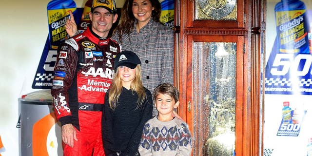 MARTINSVILLE, VA - NOVEMBER 01: Jeff Gordon, driver of the #24 AARP Member Advantages Chevrolet, his wife Ingrid Vandebosch, and their children Ella and Leo pose for a photo in Victory Lane after winning the NASCAR Sprint Cup Series Goody's Headache Relief Shot 500 at Martinsville Speedway on November 1, 2015 in Martinsville, Virginia. (Photo by Chris Trotman/NASCAR via Getty Images)