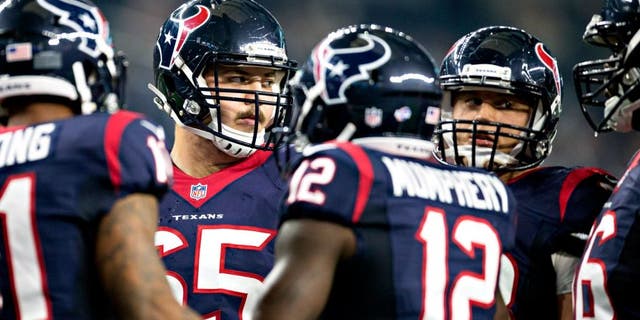 ARLINGTON, TX - SEPTEMBER 3: Greg Mancz #65 of the Houston Texans in the huddle during a preseason game against the Dallas Cowboys at AT&T Stadium on September 3, 2015 in Arlington, Texas. The Cowboys defeated the Texans 21-14. (Photo by Wesley Hitt/Getty Images)