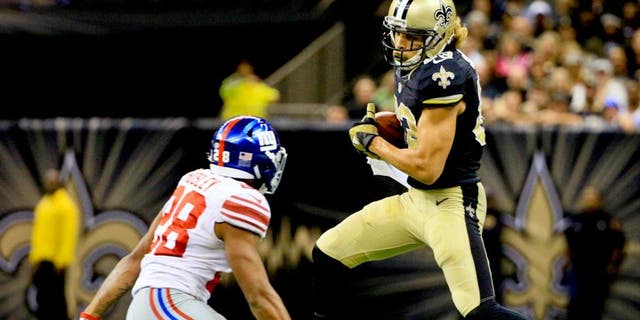 Nov 1, 2015; New Orleans, LA, USA; New Orleans Saints wide receiver Willie Snead (83) catches a pass in front of New York Giants cornerback Jayron Hosley (28) during the fourth quarter of a game at the Mercedes-Benz Superdome. The Saints defeated the Giants 52-49. Mandatory Credit: Derick E. Hingle-USA TODAY Sports