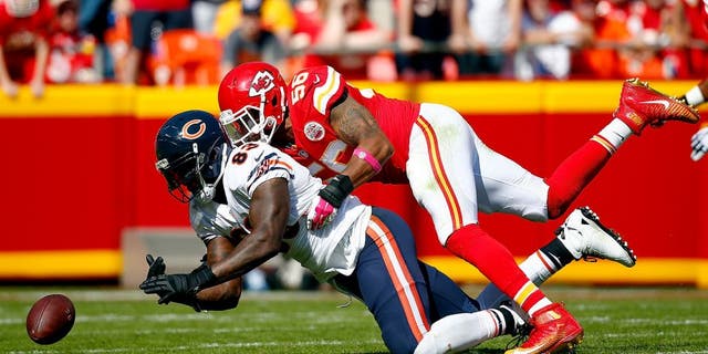 KANSAS CITY, MO - OCTOBER 11: Inside linebacker Derrick Johnson #56 of the Kansas City Chiefs breaks up a pass intended for tight end Martellus Bennett #83 of the Chicago Bears during the game at Arrowhead Stadium on October 11, 2015 in Kansas City, Missouri. (Photo by Jamie Squire/Getty Images)
