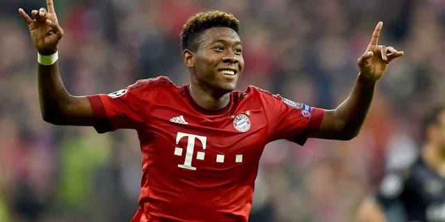 Bayern Munich's Austrian defender David Alaba celebrates after scoring the third goal during the UEFA Champions League Group F second-leg football match between FC Bayern Munich and Arsenal FC in Munich, southern Germany, on November 4, 2015. AFP PHOTO / CHRISTOF STACHE (Photo credit should read CHRISTOF STACHE/AFP/Getty Images)