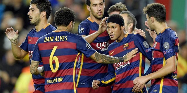 Barcelona's Brazilian forward Neymar (2ndR) celebrates with his teammates after scoring a goal during the UEFA Champions League group E football match FC Barcelona vs FC BATE Borisov at the Camp Nou stadium in Barcelona on November 4, 2015. AFP PHOTO/ LLUIS GENE (Photo credit should read LLUIS GENE/AFP/Getty Images)