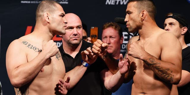 MEXICO CITY, MEXICO - JUNE 12: (L-R) Cain Velasquez of the United States and Fabricio Werdum of Brazil face off during the UFC 188 weigh-in inside the Arena Ciudad de Mexico on June 12, 2015 in Mexico City, Mexico. (Photo by Josh Hedges/Zuffa LLC/Zuffa LLC via Getty Images)