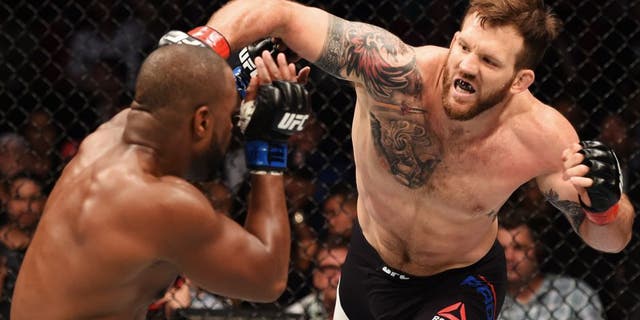 HOUSTON, TX - OCTOBER 03: (R-L) Ryan Bader punches Rashad Evans in their light heavyweight bout during the UFC 192 event at the Toyota Center on October 3, 2015 in Houston, Texas. (Photo by Josh Hedges/Zuffa LLC/Zuffa LLC via Getty Images)