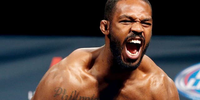 LAS VEGAS, NV - JANUARY 02: UFC light heavyweight champion Jon "Bones" Jones poses on the scale after weighing in during the UFC 182 weigh-in event at the MGM Grand Conference Center on January 2, 2015 in Las Vegas, Nevada. (Photo by Josh Hedges/Zuffa LLC/Zuffa LLC via Getty Images)