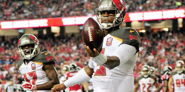 Jameis Winston #3 of the Tampa Bay Buccaneers celebrates a rushing touchdown during the second half against the Atlanta Falcons at the Georgia Dome on November 1, 2015 in Atlanta, Georgia. (Photo by Scott Cunningham/Getty Images)