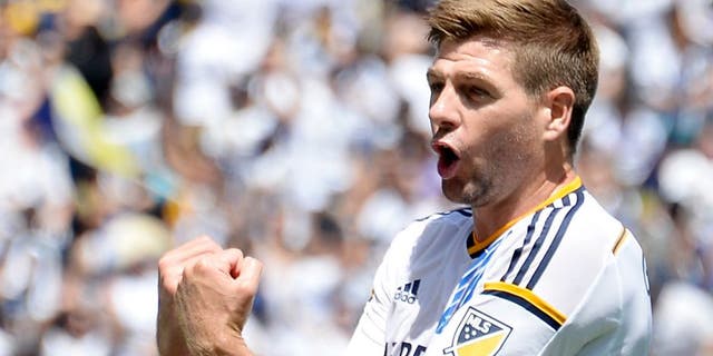 CARSON, CA - AUGUST 23: Steven Gerrard #8 of the Los Angeles Galaxy celebrates teammate Gyasi Zarde's #11 goal against the New York City FC during the first half at StubHub Center August 23, 2015, in Carson, California. (Photo by Kevork Djansezian/Getty Images)