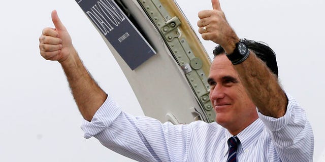 Nov. 5, 2012: Republican presidential candidate, former Massachusetts Gov. Mitt Romney gives two thumbs up as he boards his campaign plane.