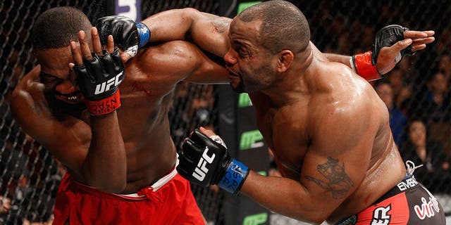 LAS VEGAS, NV - JANUARY 03: Daniel Cormier (R) punches Jon Jones (L) in their UFC light heavyweight championship bout during the UFC 182 event at the MGM Grand Garden Arena on January 3, 2015 in Las Vegas, Nevada. (Photo by Josh Hedges/Zuffa LLC/Zuffa LLC via Getty Images)