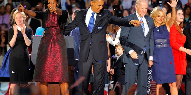 Nov. 7 2012: President Barack Obama , joined by his wife Michelle, Vice President Joe Biden and his spouse Jill acknowledge applause after Obama delivered his victory speech to supporters gathered in Chicago.