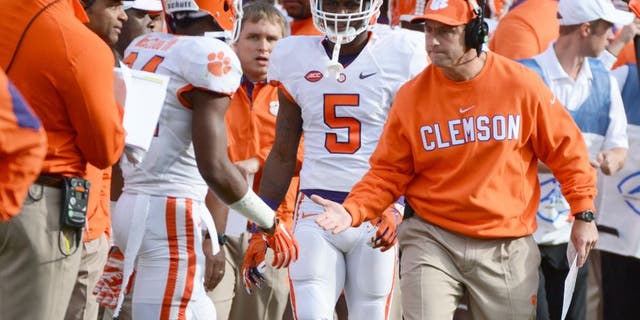 Oct 31, 2015; Raleigh, NC, USA; Clemson Tigers head coach Dabo Swinney congratulates wide receiver Ray-Ray McCloud (34) after a return during the first half against the North Carolina State Wolfpack at Carter Finley Stadium. Mandatory Credit: Rob Kinnan-USA TODAY Sports