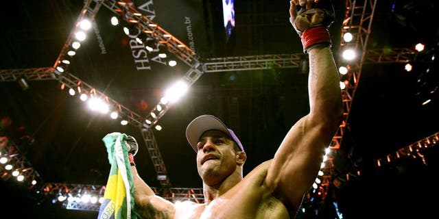 RIO DE JANEIRO, BRAZIL - JANUARY 14: Vitor Belfort celebrates defeating Anthony Johnson (not pictured) in a middleweight bout during UFC 142 at HSBC Arena on January 14, 2012 in Rio de Janeiro, Brazil. (Photo by Josh Hedges/Zuffa LLC/Zuffa LLC via Getty Images)