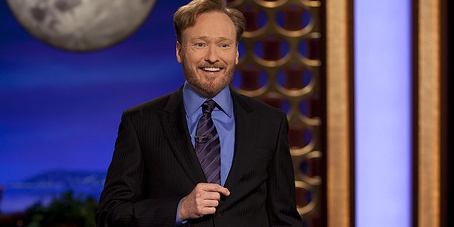 Nov. 8: In this photo provided by TBS, Conan O'Brien performs during the debut of his new TBS show 'Conan.'