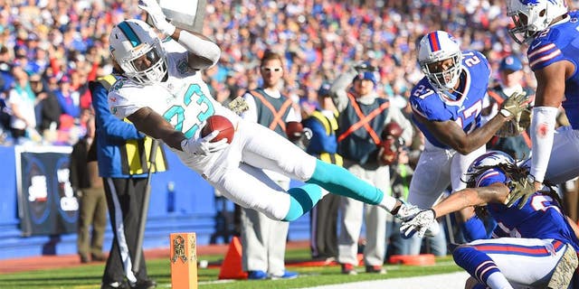 ORCHARD PARK, NY - NOVEMBER 08: Jay Ajayi #23 of the Miami Dolphins comes up short of a touchdown against the Buffalo Bills during the second half at Ralph Wilson Stadium on November 8, 2015 in Orchard Park, New York. (Photo by Rich Barnes/Getty Images)