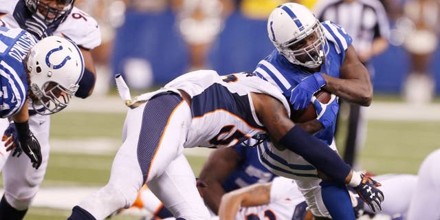Nov 8, 2015; Indianapolis, IN, USA; Indianapolis Colts running back Frank Gore (23) runs with the ball against the Denver Broncos at Lucas Oil Stadium. Indianapolis defeats Denver 27-24. Mandatory Credit: Brian Spurlock-USA TODAY Sports