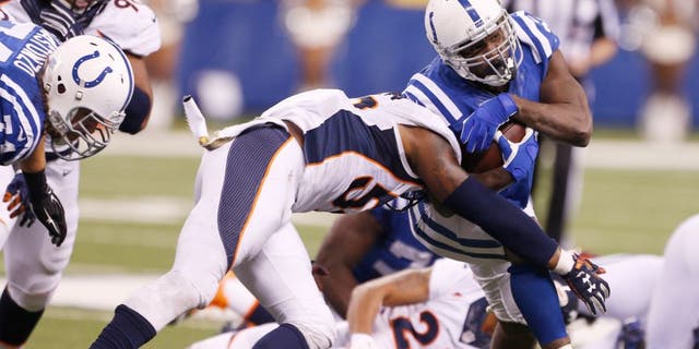Nov 8, 2015; Indianapolis, IN, USA; Indianapolis Colts running back Frank Gore (23) runs with the ball against the Denver Broncos at Lucas Oil Stadium. Indianapolis defeats Denver 27-24. Mandatory Credit: Brian Spurlock-USA TODAY Sports