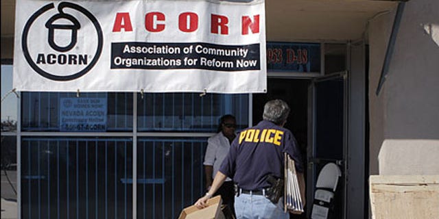 An investigator enters the ACORN office in Las Vegas, Oct. 7, 2008.