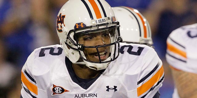 Oct. 9: Auburn quarterback Cameron Newton looks for a receiver during the first half of an NCAA college football game against Kentucky, in Lexington, Ky.