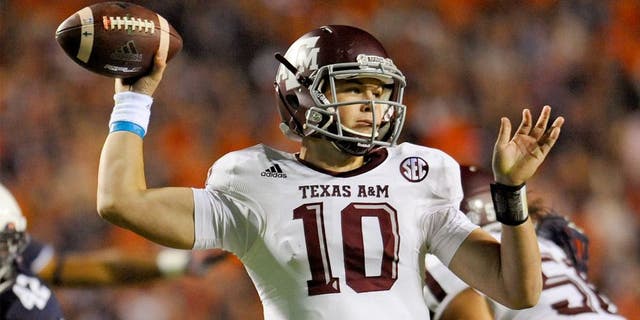 Nov 8, 2014; Auburn, AL, USA; Texas A&M Aggies quarterback Kyle Allen (10) looks to pass against the Auburn Tigers at Jordan Hare Stadium. Texas A&M won 41-38. Mandatory Credit: Shanna Lockwood-USA TODAY Sports