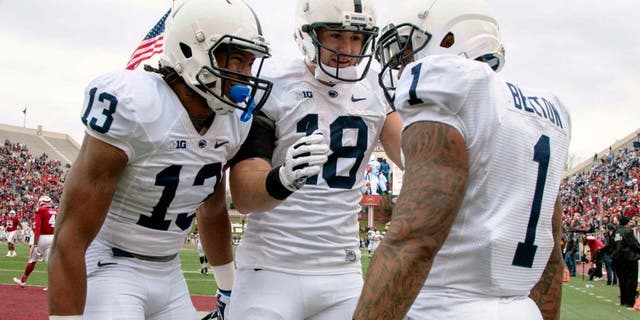 Nov 8, 2014; Bloomington, IN, USA; Penn State Nittany Lions running back Bill Belton (1) celebrates his touchdown with teammates wide receiver Saeed Blacknall (13) and tight end Jesse James (18) in the second quarter of the game at Memorial Stadium. Mandatory Credit: Trevor Ruszkowski-USA TODAY Sports