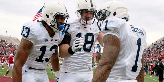 Nov 8, 2014; Bloomington, IN, USA; Penn State Nittany Lions running back Bill Belton (1) celebrates his touchdown with teammates wide receiver Saeed Blacknall (13) and tight end Jesse James (18) in the second quarter of the game at Memorial Stadium. Mandatory Credit: Trevor Ruszkowski-USA TODAY Sports
