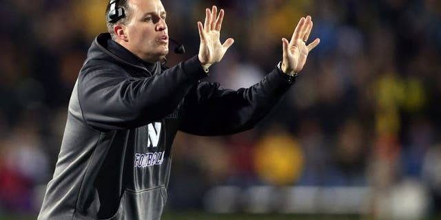 Nov 8, 2014; Evanston, IL, USA; Northwestern Wildcats head coach Pat Fitzgerald gestures to his team in the fourth quarter against the Michigan Wolverines at Ryan Field. Mandatory Credit: Jerry Lai-USA TODAY Sports