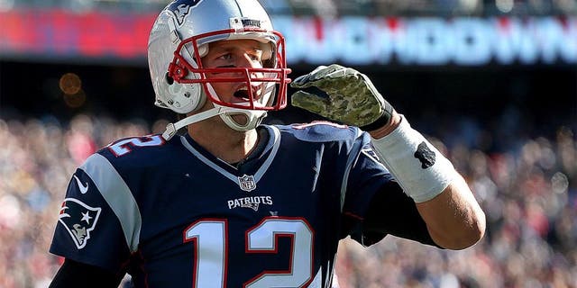 FOXBORO, MA - NOVEMBER 8: Tom Brady #12 of the New England Patriots celebrates a touchdown by LeGarrette Blount #29 in the first half against the Washington Redskins at Gillette Stadium on November 8, 2015 in Foxboro, Massachusetts. (Photo by Jim Rogash/Getty Images)