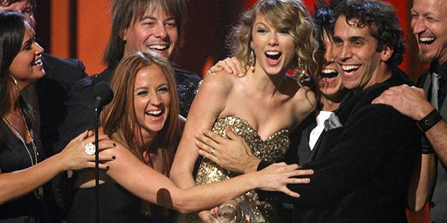 Nov. 11: Taylor Swift accepts the Entertainer of the Year Award on stage during the 43rd Annual Country Music Awards in Nashville, Tenn. (AP)