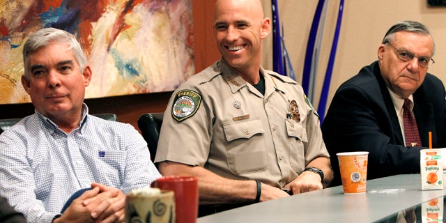 Nov. 1: From left, Cochise County Sheriff Larry Dever, Pinal County Sheriff Paul Babeu, and Maricopa County Sheriff Joe Arpaio watch the proceedings, as the 9th U.S. Circuit Court of Appeals takes up the new Arizona immigration law, at the Rose Law Group offices in Scottsdale, Ariz.